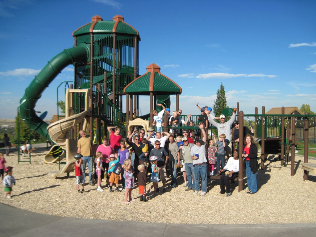 Estates-Park Group of residents at the playground in Estates Park.
