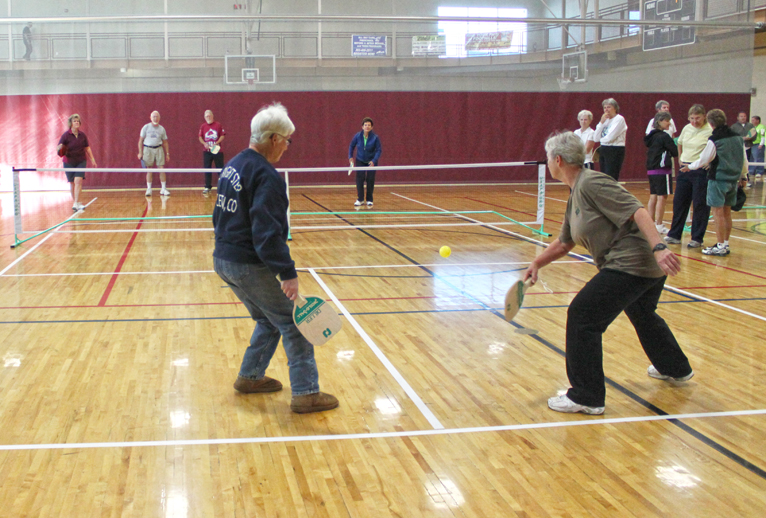 People playing pickleball.