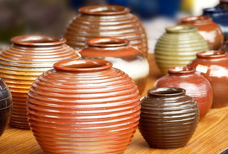 A group of pottery pieces on display.