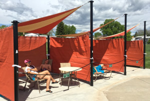 Cabanas available for rent at an outdoor pool.
