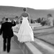 A bride and groom posing on their wedding day.