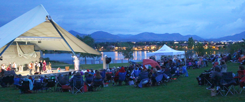 Theatre production occurring at dusk on the Grant Amphitheater in Clement Park