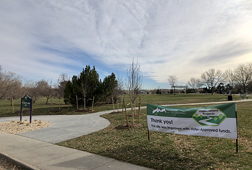 Park sign and sidewalk entry view of Governor James B. Grant Park