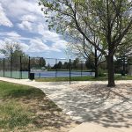 Sidewalk view of the tennis courts at Dakota Station Park.