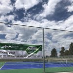 Thank you sign hung on tennis court fencing at Lilley Gulch Park.