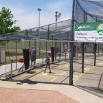 Youth practicing their batting skills at the batting cages