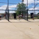 Youth practicing their batting skills at the batting cages