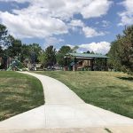 Sidewalk view leading to the playground and park shelter in Chaucer Park.