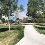 Sidewalk view leading to the playground and park shelter in Chaucer Park.