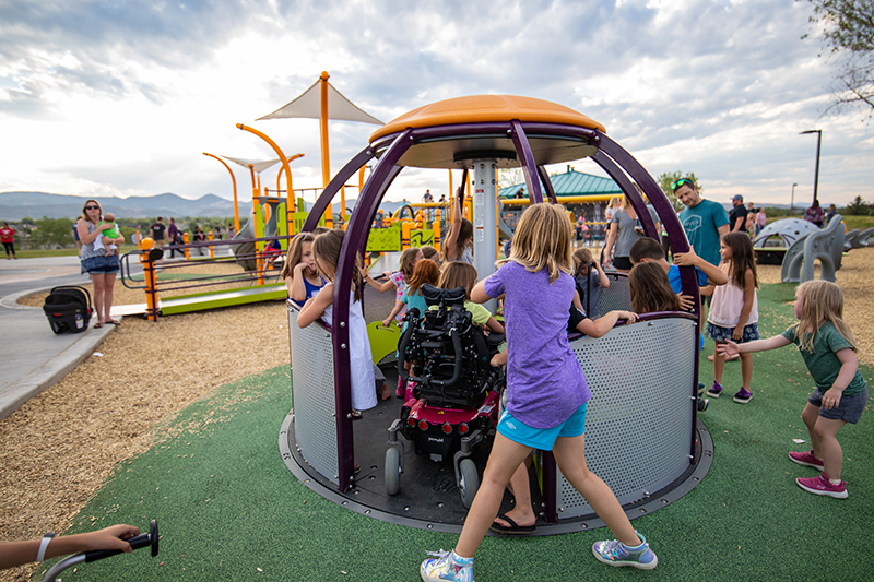 Accessible merry-go-round feature in the Inclusive Playground in Clement Park