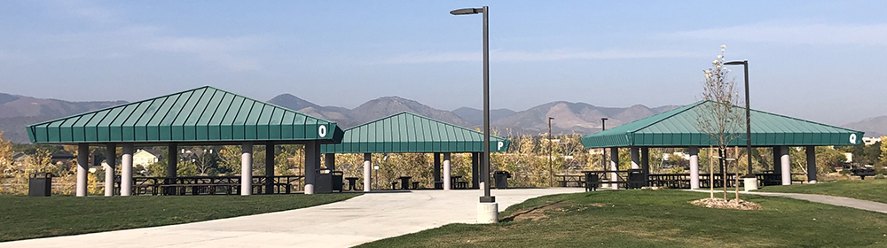 A cluster of park shelters overlooking views of the mountains in Clement Park