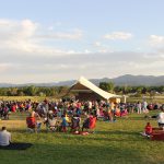 Crowd of people attending a concert at the Grant Amphitheater in Clement Park