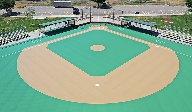 Overhead drone image of the cushioned, rubberized turf field replacement for adaptive baseball play.