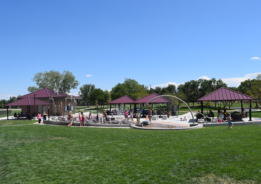 Full view of the Splash Park in Clement Park with varied water features and four park shelters
