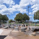 Children playing in different splash features at the Splash Park in Clement Park