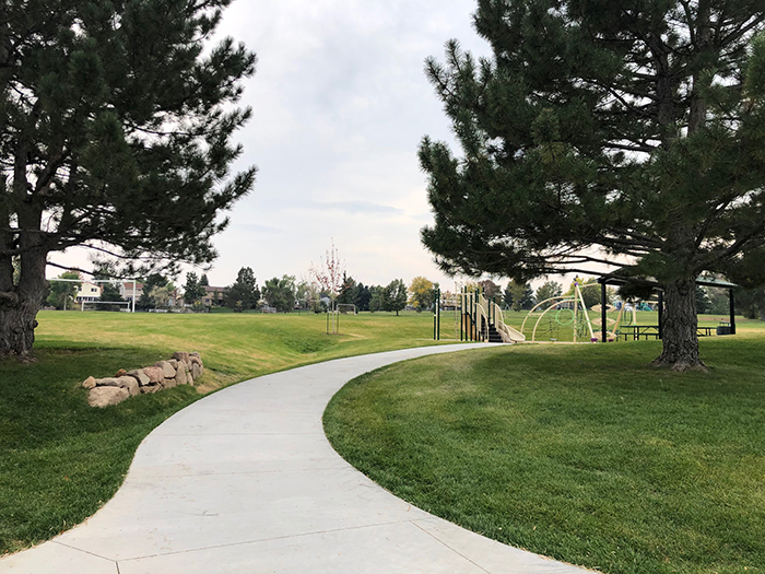 Sidewalk view leading to the playground and park shelter in Valley View Park.