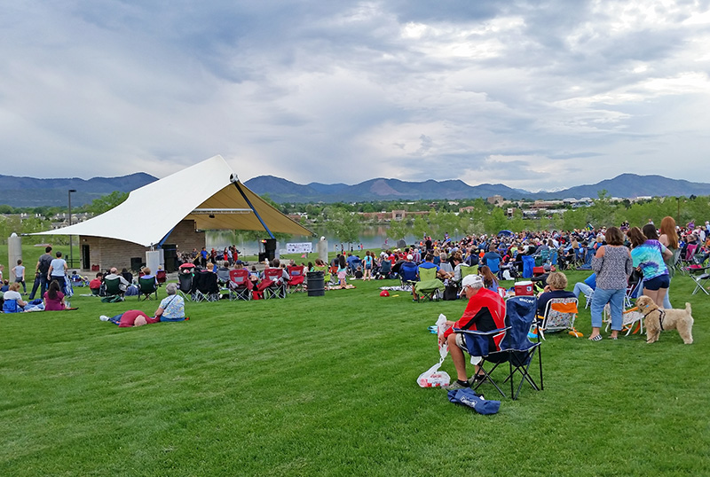 Crowd of people attending a concert at the Grant Amphitheater in Clement Park