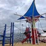 Baseball themed playground near a ballfield.