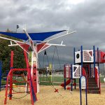 Baseball themed playground near a ballfield.