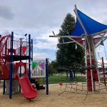 Baseball themed playground near a ballfield.