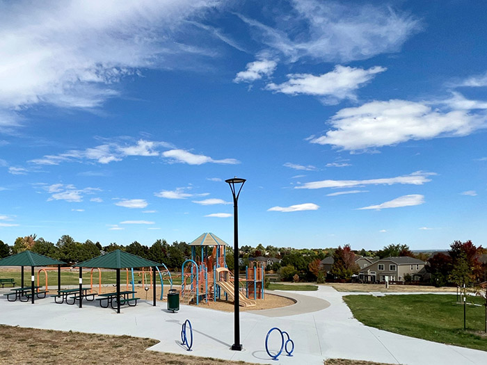 Alpers Farm Park displaying the playground, park shelters, new sidewalks, sod and tree planings.