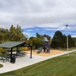 View of picnic shelter and playground in Woodmar Square Park.
