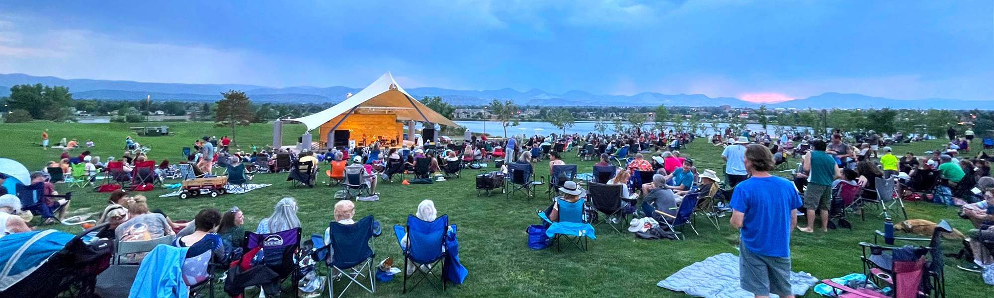 Crowd of people attending a concert at the Grant Amphitheater in Clement Park