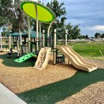 Playground structure near pickleball courts.