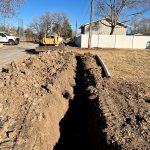 Before shot of Columbine Hill Park showing trenches in turf preparing to lay new irrigation lines.