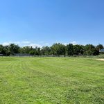 After project shot of Columbine Sports Park with green, groomed grass field.