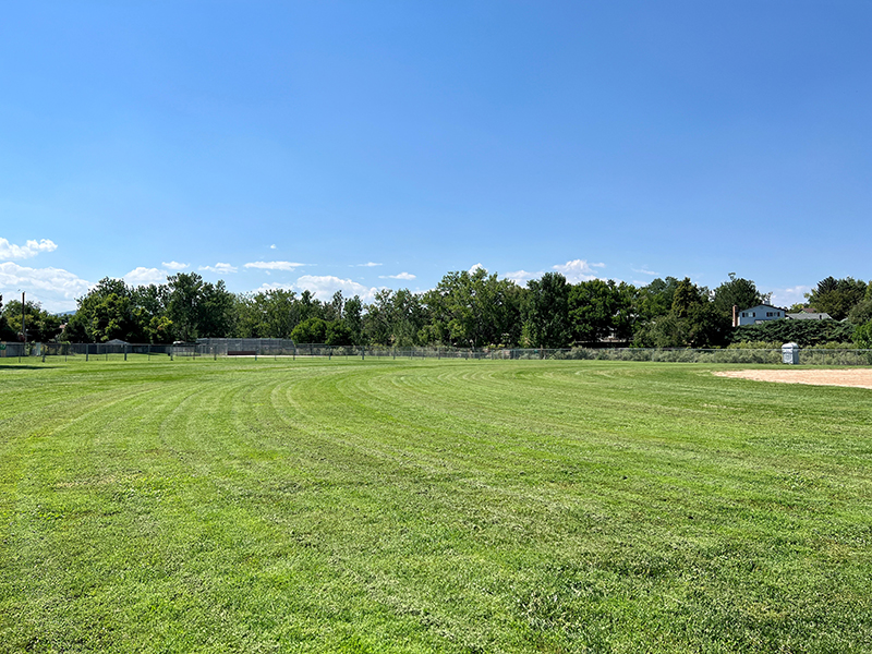 After project shot of Columbine Sports Park with green, groomed grass field.