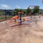 Colorful outdoor water and splash play features.