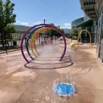 Colorful outdoor water and splash play features.
