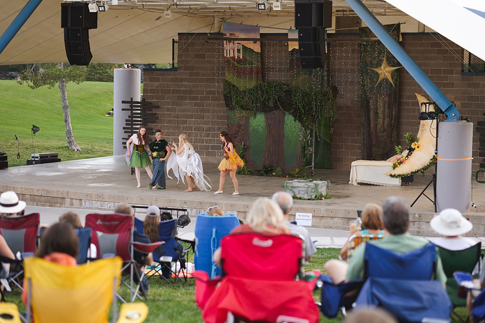 Actors for Foothills Theatre Company performing a scene on the Grant Family Amphitheater in Clement Park