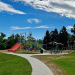 Sidewalk view leading to the playground and park shelter in Westfield Park.