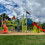 Colorful playground with red slides.