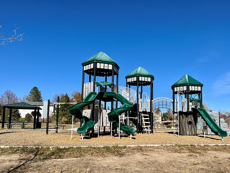 A playground with many slides and climbing apparatuses