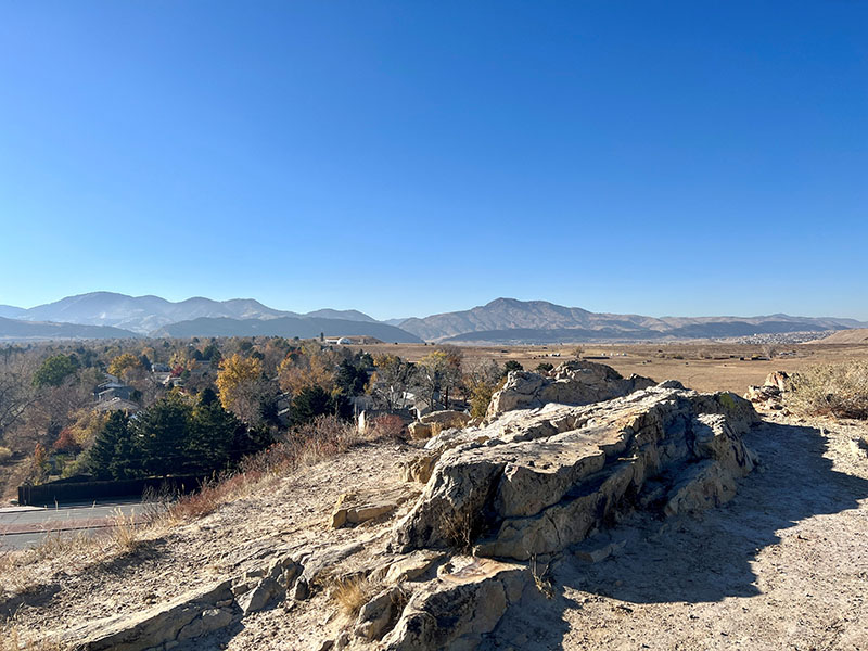 The view atop Donkey Hill showing a natural path, rocks and view of the mountains in the background