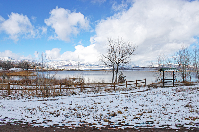 Wintery day in Harriman Lake Park showing snow covered ground, lake and mountains