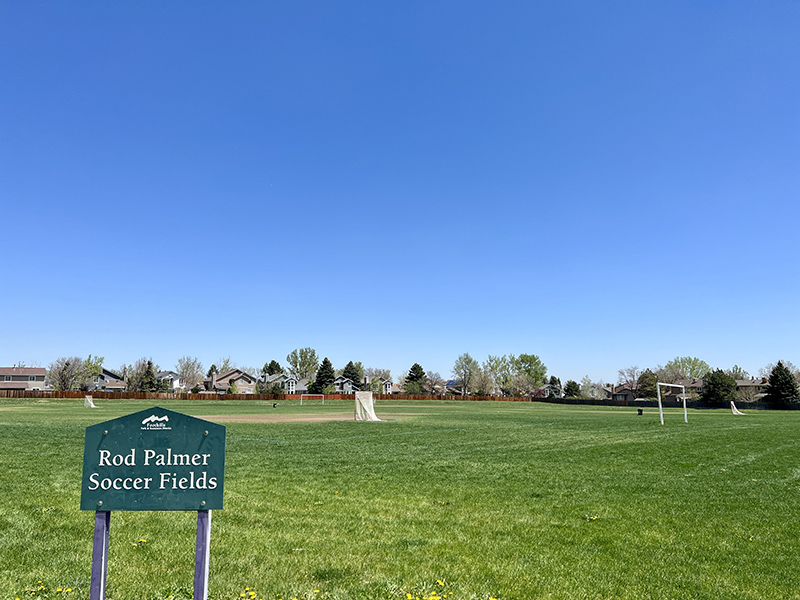 Green fields with soccer goals and and a park sign reading Rod Palmer Soccer Fields