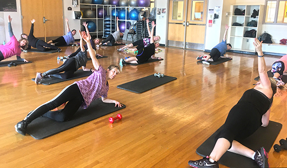 Group of people participating in a fitness class