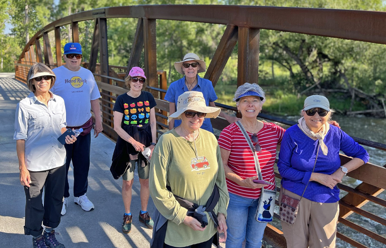 A group of adults walking together in the Walking club.