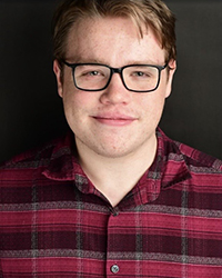 Eli Schneider Eli Schneider headshot.