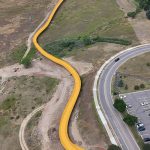 Aerial shot of Dutch Creek Trail highlighting the trail with a yellow line leading from the Ridge Recreation Center street entrance west to the C-470 Trail.