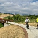 Two men on bicycles riding on the Dutch Creek Trail.