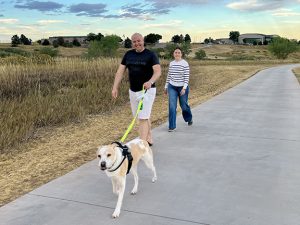 Couple walking their dog on the new Dutch Creek Trail extension.