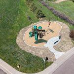 Aerial view of Lakehurst West Park showing new playground installation and walking path connecting to existing neighborhood sidewalk.